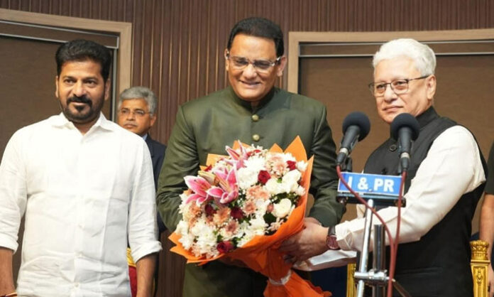 Azharuddin takes oath Telangana minister