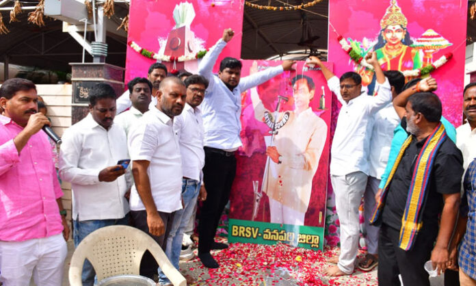 Students performing milk abhishekam on KCR’s portrait during Deeksha Divas in Wanaparthy