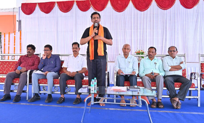 Students and officials preparing for the Karimnagar District Children’s Science Exhibition at Alphores E Techno School with models and themes like green energy, emerging technology, and sustainable agriculture