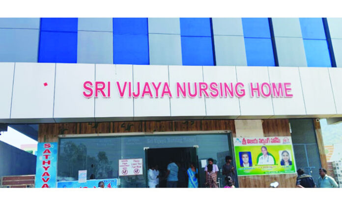 Family protesting after a newborn baby died due to alleged doctor negligence at Vijaya Nursing Home in Palwancha.