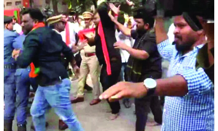 BJP cadres protesting in Nampally demanding an apology from CM Revanth Reddy over his comments on Hindu gods.