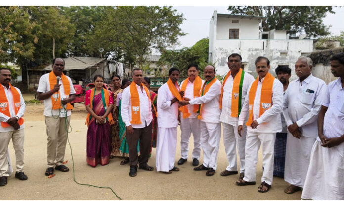 BJP leaders welcoming Thokala Tirupathaiah into the party during a gathering in Peddagudem village, Wanaparthy district.