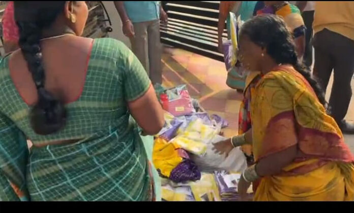 Police seizing sarees allegedly distributed by BRS leaders to voters during Gram Panchayat elections in Wanaparthy