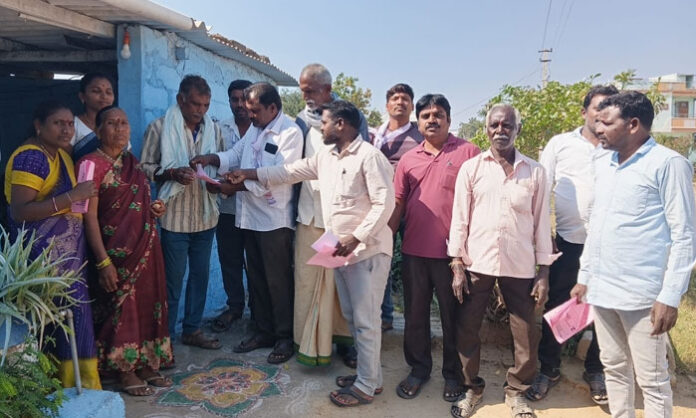 Image showing Boinpally Sarpanch candidate Nalla (Gadeela) Mohan campaigning door-to-door in the village, appealing for voter support with the backing of MLA Medipally Sathyam.
