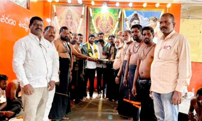Chegur Sarpanch Mankala Srisailam distributing annadanam to Ayyappa Swamy devotees at Nandigama mandal temple