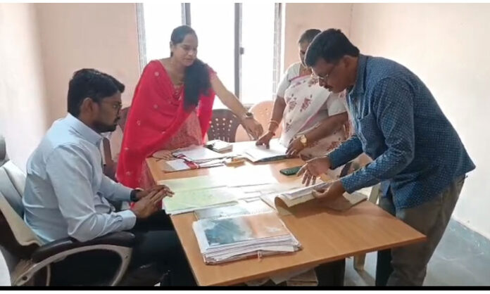 District Collector Adarsh Surabhi inspecting polling station arrangements in Gopalpet and Revalli ahead of the first phase of elections.