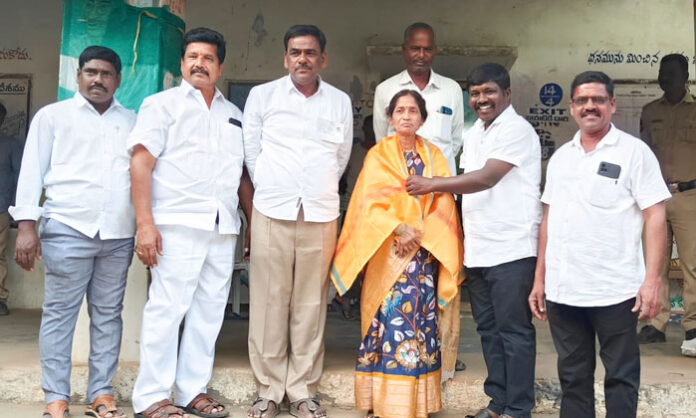Image showing Congress-backed Sarpanch candidate K. Padmamma being felicitated after winning the Allamayapalli Sarpanch election.