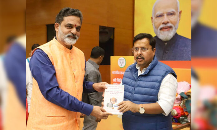 Dr Vakulabharanam Krishnamohan Rao meets BJP Working President Nitin Nabin at the BJP central office in New Delhi and presents his book on GST reforms and social justice.