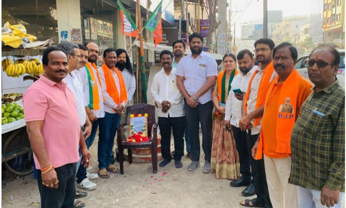 BJP leaders and workers participating in Atal Bihari Vajpayee birth anniversary celebrations near Nizampet Hanuman Temple