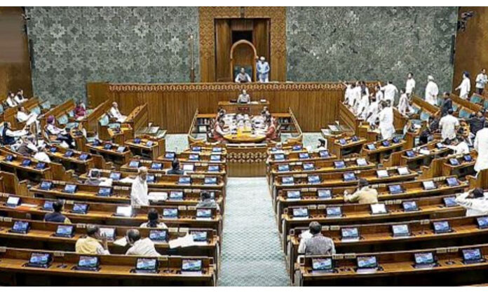 Opposition MPs protesting inside Parliament over the voters’ list amendment and raising concerns about privacy violations linked to the Sanchar Saathi app.