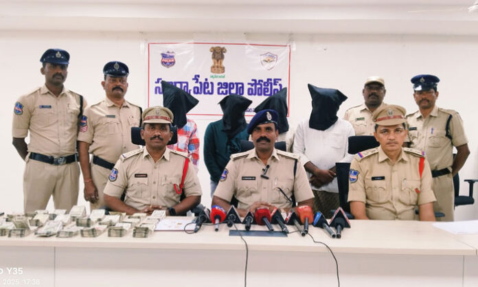Suryapet Rural Police displaying seized fake gold biscuits, cash, and mobile phones after arresting four members of a fake gold racket involved in a ₹12 lakh fraud.