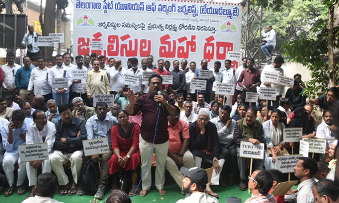 TSUWJ journalists staging a large dharna demanding government attention to their pending issues and welfare concerns.