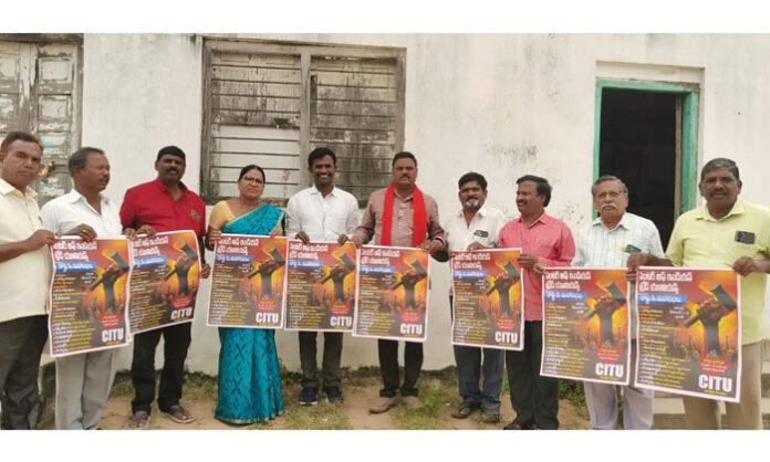 CITU District Presidents and Secretaries unveiling posters for Telangana State 5th Congress in Medak, calling for labor rights awareness and protest against four labor codes.