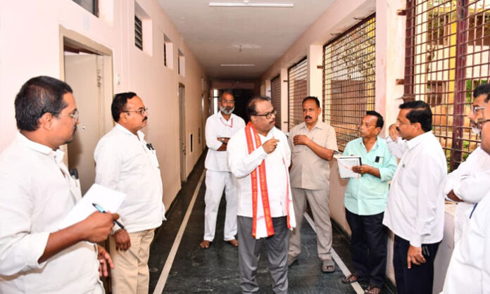 EO Venkat Rao inspecting Pathagutta Temple arrangements for Vaikuntha Ekadashi, ensuring devotee facilities, sanitation, lighting, and decorations are properly managed.