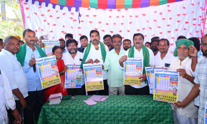 MLA KR Nagaraju and DCC President MD Ayub unveiling Aadab Hyderabad 2026 New Year calendar at Choutapalli village in Warangal district