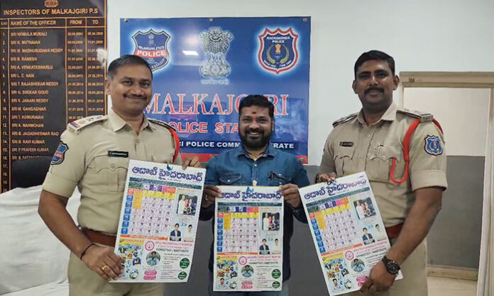 Malkajgiri CI Satyanarayana unveiling Aadab Hyderabad daily newspaper calendar