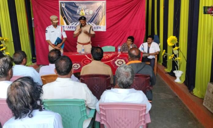 Hyderabad Traffic Police conducting Arrive Alive road safety awareness program at Manikeswar Nagar.