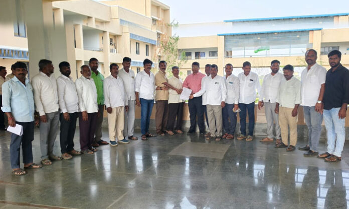 Villagers of Appareddyguda submit a complaint at the Collectorate public grievance program against the Deputy Sarpanch over village administration issues.