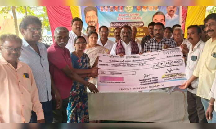 Tungaturthi MLA Mandula Samuel distributes handloom loan waiver checks to weavers in Mothkur under Congress government welfare scheme