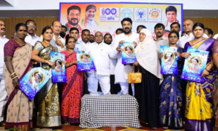BRS MLA Kale Yadaiah distributing Indiramma sarees at a Congress government program in Moinabad