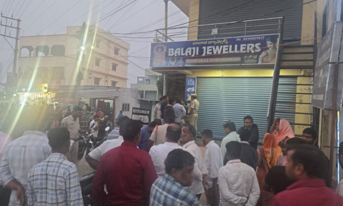 Injured jewelry shop owner after assailants attempted robbery using a fake gun at Balaji Jewelers in Nagaram.