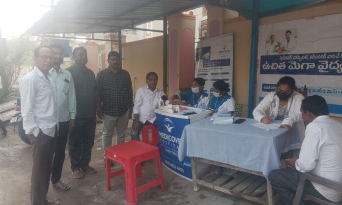 Doctors and staff from Medicover Hospital conducting free blood pressure and blood sugar tests at Sri Bhavani Colony in Karimnagar.