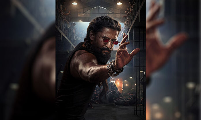 Nani in a menacing look as Jadal from The Paradise, showcasing rugged beard, braided hair, red-tinted glasses, and action-ready appearance