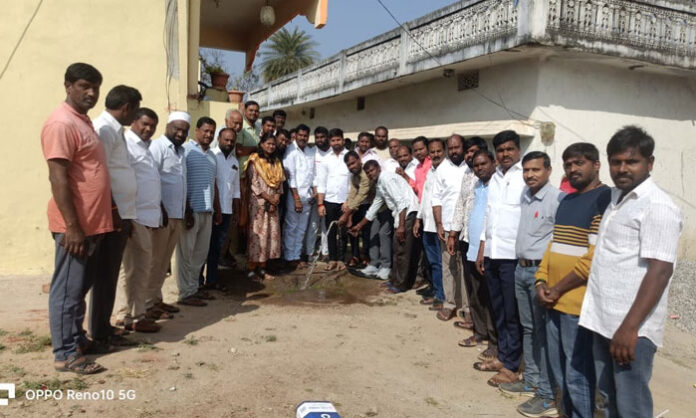 Sarpanch Kommu Krishna inaugurating borewell motors in various wards of Nandigama mandal in the presence of ward members and villagers.