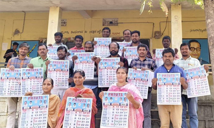 MEO Vithal unveiling the PRTU TS new calendar at Chandur High School in Chilipched mandal.
