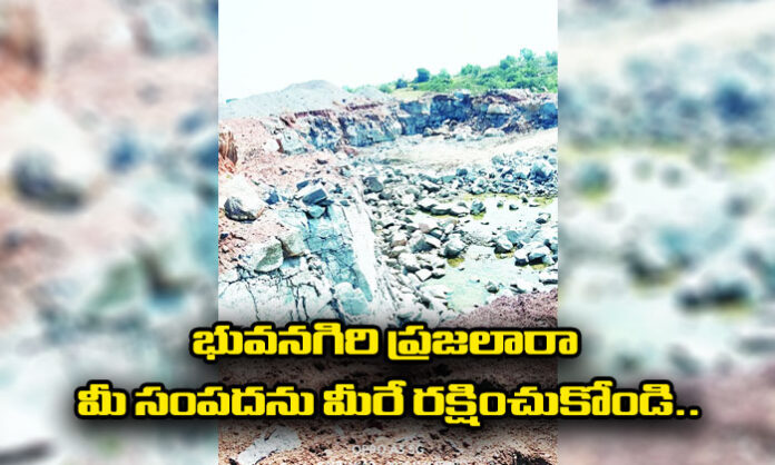 People and organizations protest against an illegal stone crusher operating on government land in Chellur village, Rajapet mandal, Yadadri Bhongir district.