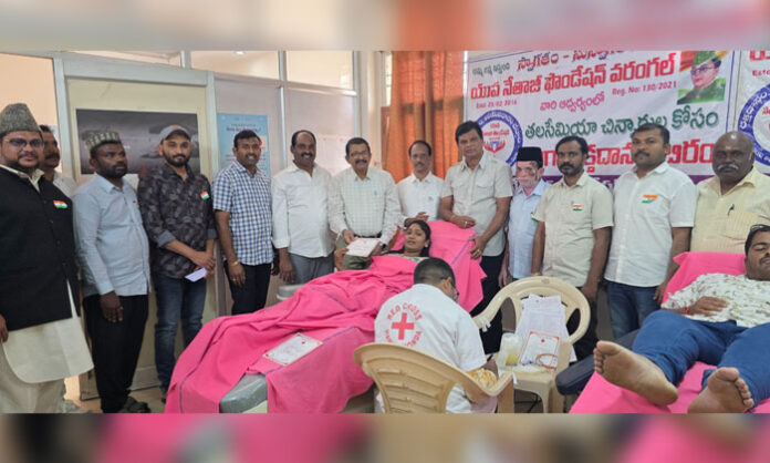 Volunteers donate blood at Red Cross Society blood donation camp in Hanamkonda on Republic Day