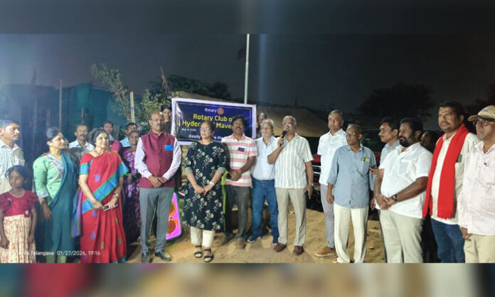 Rotary Club of Hyderabad members inspecting solar lights installed at the Kuntloor land struggle center in Abdullapurmet mandal