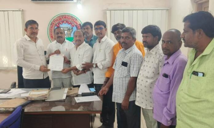 Sarpanches submitting a petition to the Nalgonda Bus Depot Regional Manager requesting bus service