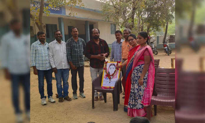 MEO Vithal paying tribute to Savitribai Phule’s portrait during Women Teachers’ Day celebrations at ZPHS Somakkapeta.