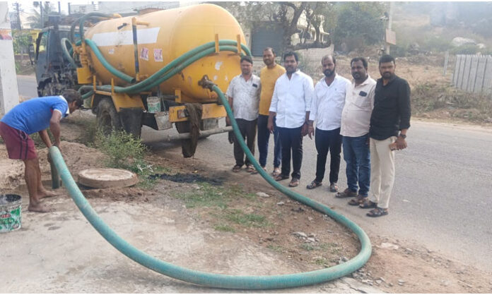 Abdullahpur village ward members and Panchayat representatives overseeing underground drainage cleaning works in Rangareddy district.