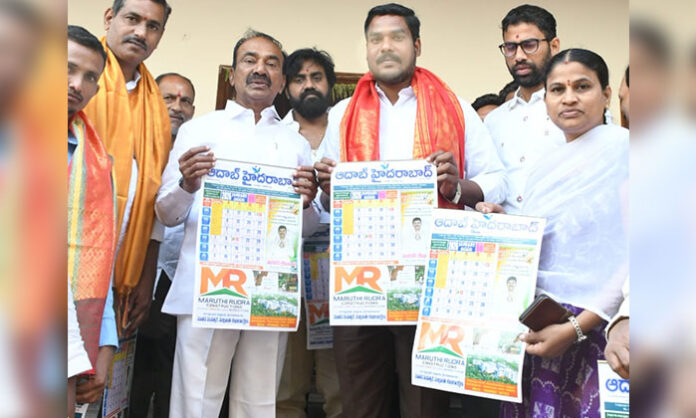 Etala Rajender and Kandukuri Prashanth launching the AAdab Hyderabad 2026 calendar at a media event in Hyderabad.