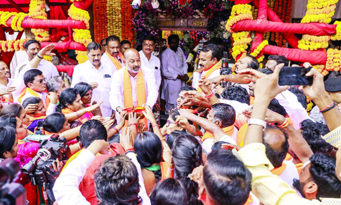 Union Minister addressing media after visiting temple and expressing confidence about GHMC elections