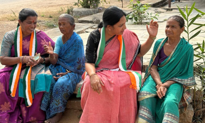 Bandru Shobha Rani interacting with an elderly woman during door-to-door election campaign in Alair