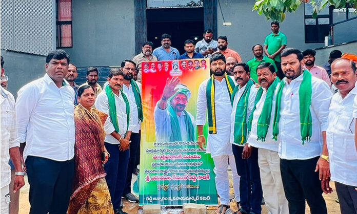 Ruling party leaders performing fruit juice anointment to CM portrait celebrating fruit market approval