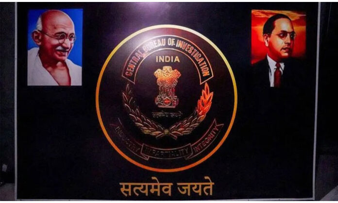 Cambodian authorities inspecting a digital scam center with fake Indian police logos and flags