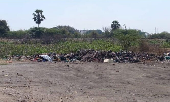 Severely polluted Chennapuram pond in Jawahar Nagar filled with garbage and weeds