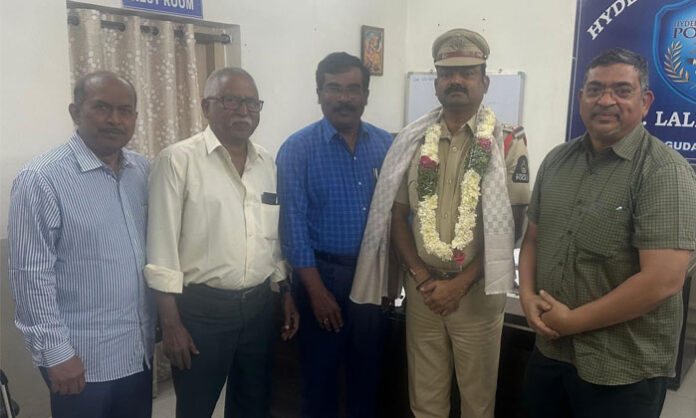 Church association members meeting Lalaguda Inspector T Ashok Kumar and congratulating him