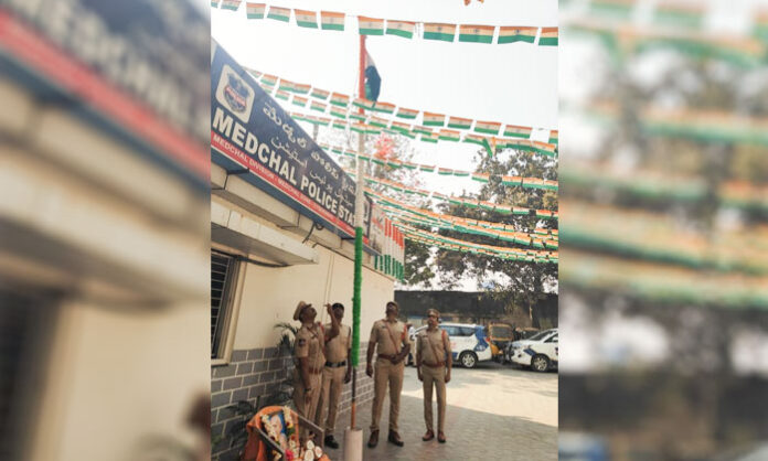 ACP Venkat Reddy hoisting the national flag during Cyberabad Police 24th anniversary celebrations in Medchal