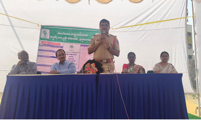 CI Mohammed Maqbool Jani addressing a cybercrime awareness seminar organized by Telangana Cooperative Apex Bank for bank customers