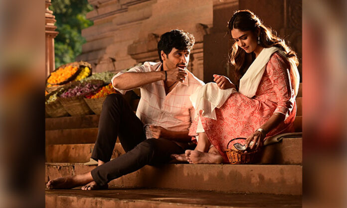 Poster of Dacoit featuring Adivi Sesh and Mrunal Thakur announcing the first single Rubaroo release