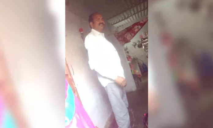 Voters arguing with a candidate’s husband in Ellampet after he allegedly demanded money back following election defeat