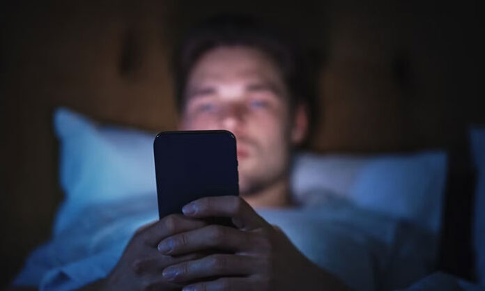 Health experts warn about the harmful effects of using mobile phones before sleep including insomnia stress and reduced sleep quality