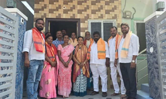Beneficiaries performing housewarming ceremony under Indiramma housing scheme in Jawahar Nagar