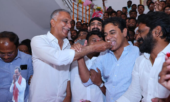 Leaders cutting a cake during birthday celebrations of K. Chandrashekar Rao at Telangana Bhavan