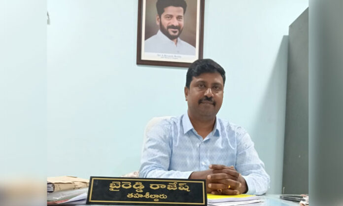 Revenue officials demolishing illegal constructions on government lands in Kapra mandal under Tahsildar orders